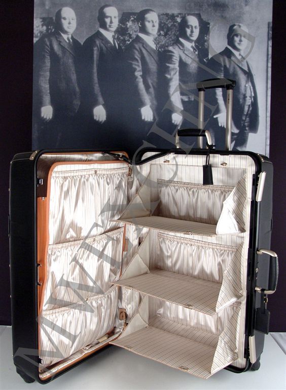 reflects the timeless elegance of trunk travel with compartmentalized 